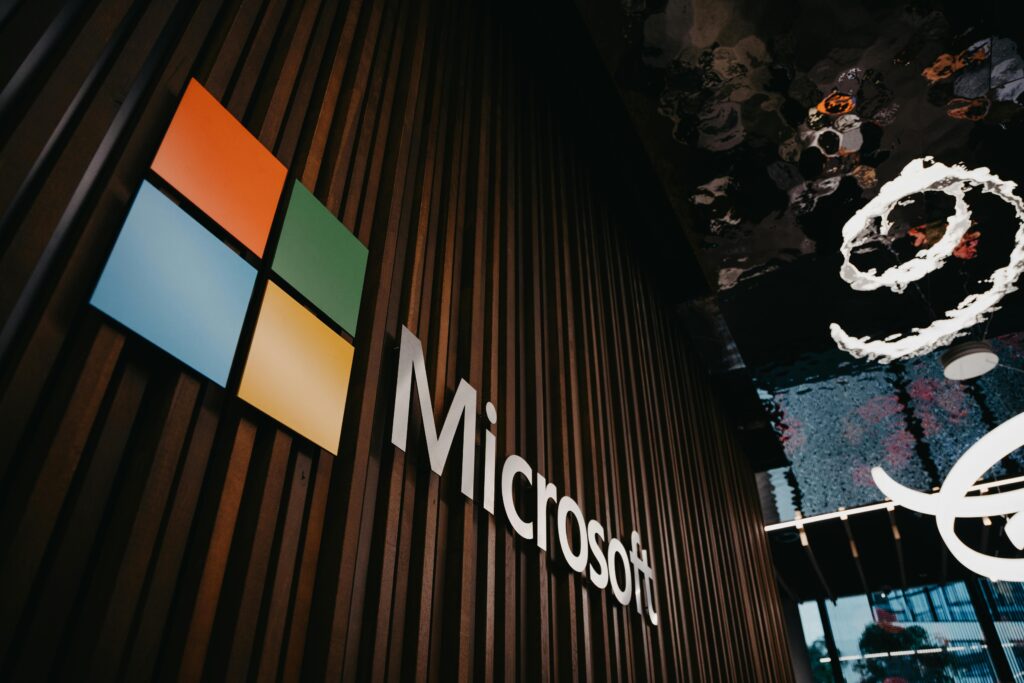 Microsoft Aurora AI: Previsão Climática Precisa 2 Interior view of Microsoft office with logo on wooden wall in Brussels, Belgium.