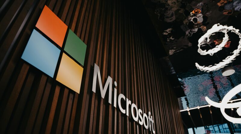 Interior view of Microsoft office with logo on wooden wall in Brussels, Belgium.