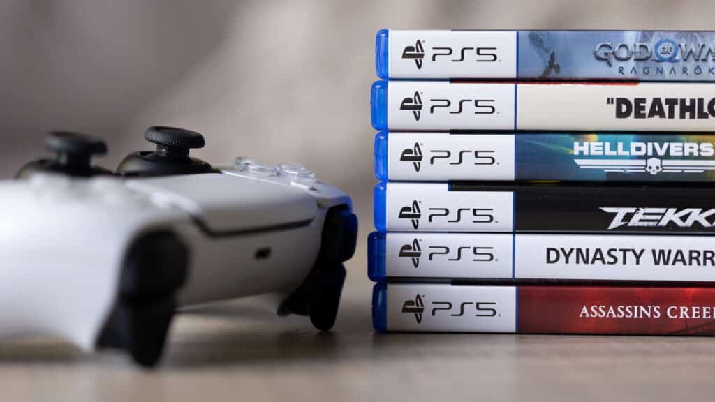 Controle DualSense e jogos físicos - Créditos: depositphotos.com / joerimostmans