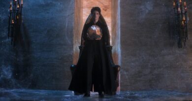 Morpheus the Endless Lord of the Dreaming, standing in black robes while holding a talisman