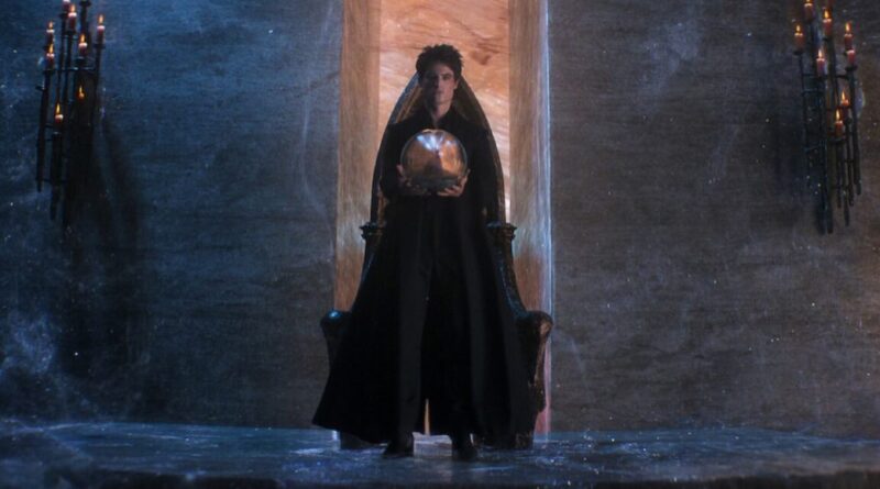 Morpheus the Endless Lord of the Dreaming, standing in black robes while holding a talisman