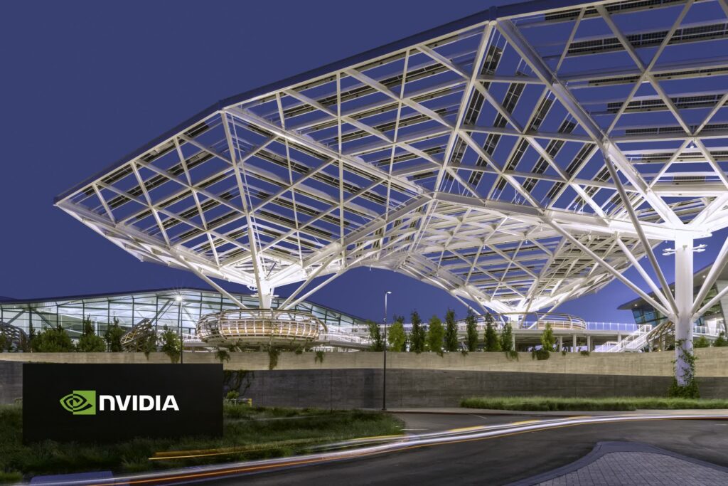Nvidia ultrapassa Apple e se aproxima de US$ 4 trilhões em valor 2 Nvidia se aproxima de US$ 4 trilhões em valor, ultrapassando Apple, gráfica ilustrando valorização recorde na Nasdaq com prédios de tecnologia e gráficos ascendentes.