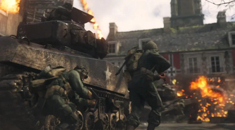 Imagem promocional do jogo Call of Duty: WWII mostrando ação militar intensa, com ênfase em cenário da Segunda Guerra mundial, destacando personagem principal, bandeira dos Estados Unidos e ambiente de combate.