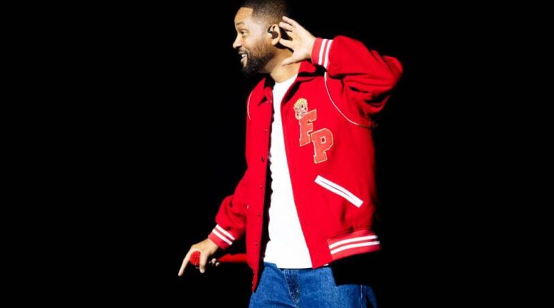 Will Smith vídeo IA: foto de show com multidão e luzes, gerando debate sobre autenticidade