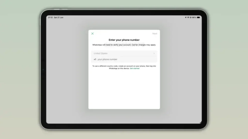 Tela do WhatsApp no iPad para inserir número de telefone e verificar conta
